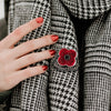 To Absent Friends Poppy Brooch worn on check scarf | Poppyscotland
