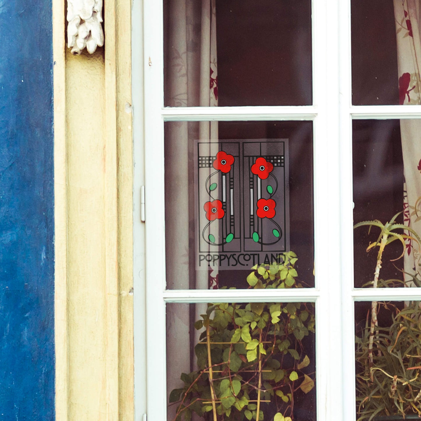 Macintosh Window Decal shown on home window - Poppyscotand