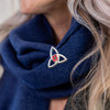 Trinity Knot Poppy Brooch worn on navy scarf | Poppyscotland