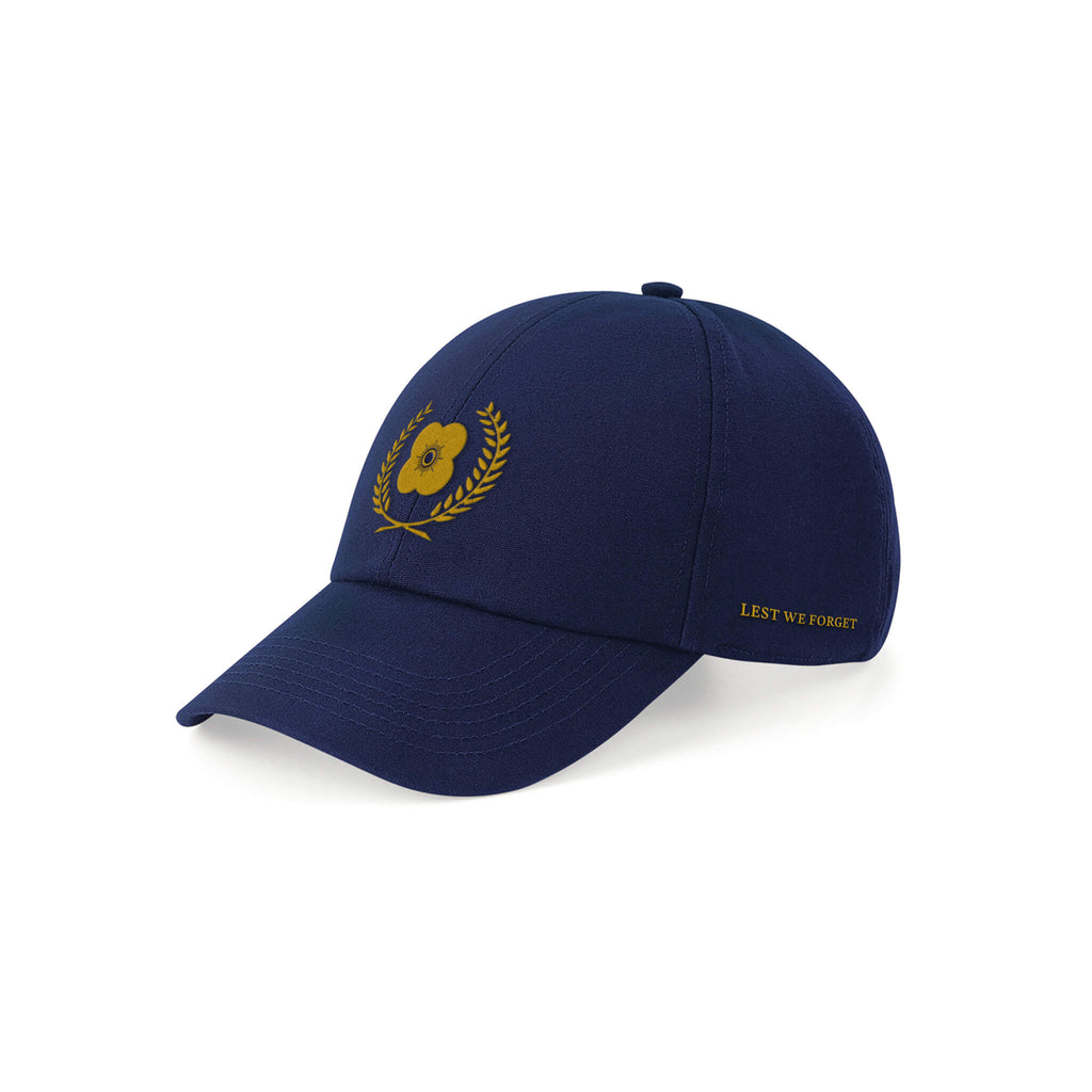 Navy Poppyscotland organic cotton baseball cap with gold embroidered poppy on the front, and Lest We Forget on the side.